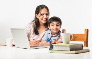 A mother and her child engaged in online learning together in a cozy home environment. The mother is seated beside the student, offering support and guidance as they navigate through educational materials on a digital device. The screen displays learning content, and both individuals appear focused and engaged in the online learning experience